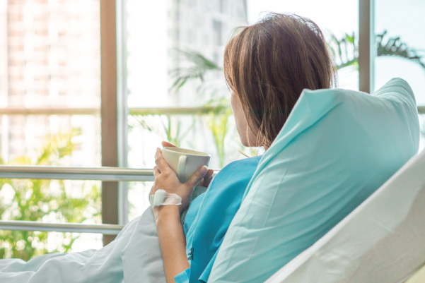 Woman in hospital bed