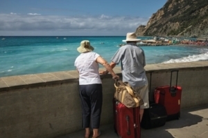 Senior Couple arriving at beach