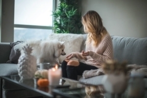 Woman at home with her dog